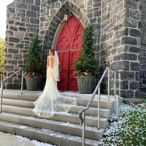 Victoria on the steps of Saint James Place in Great Barrington
