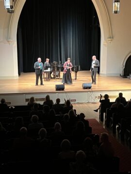 Michael Pizzi and collaborators on the Saint James Place Sanctuary Space Stage singing a song from the Andrew Lloyd Webber Songbook.