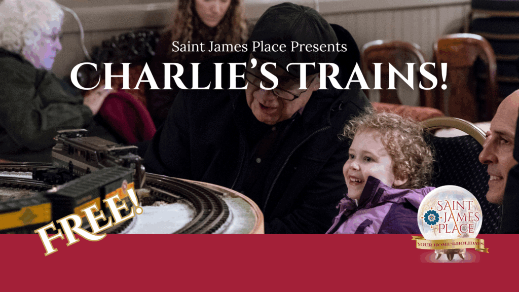 grandpa and grandchild looking at holiday model trains