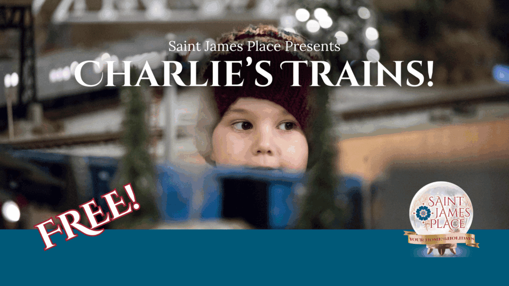 Boy in winter hat watching holiday model trains